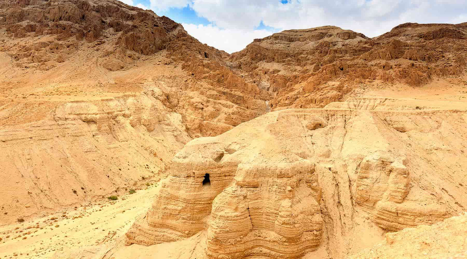 Photo of a cave at Qumran in Israel for Unearthing the Bible