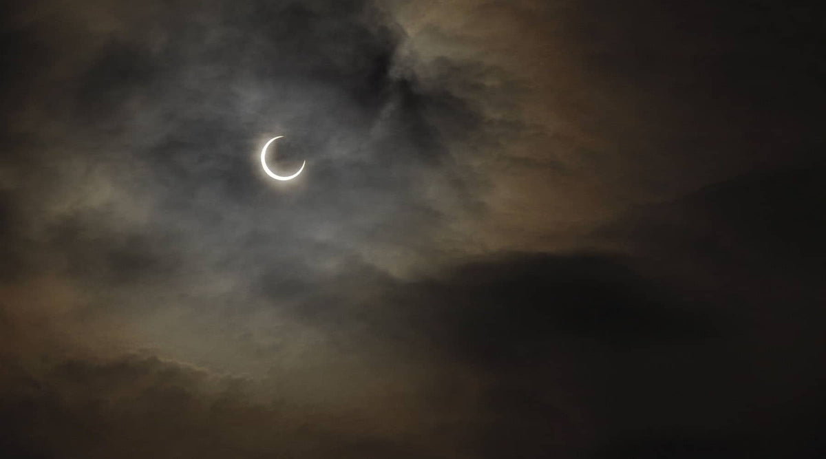 Picture of the daytime sky showing a partial solar eclipse