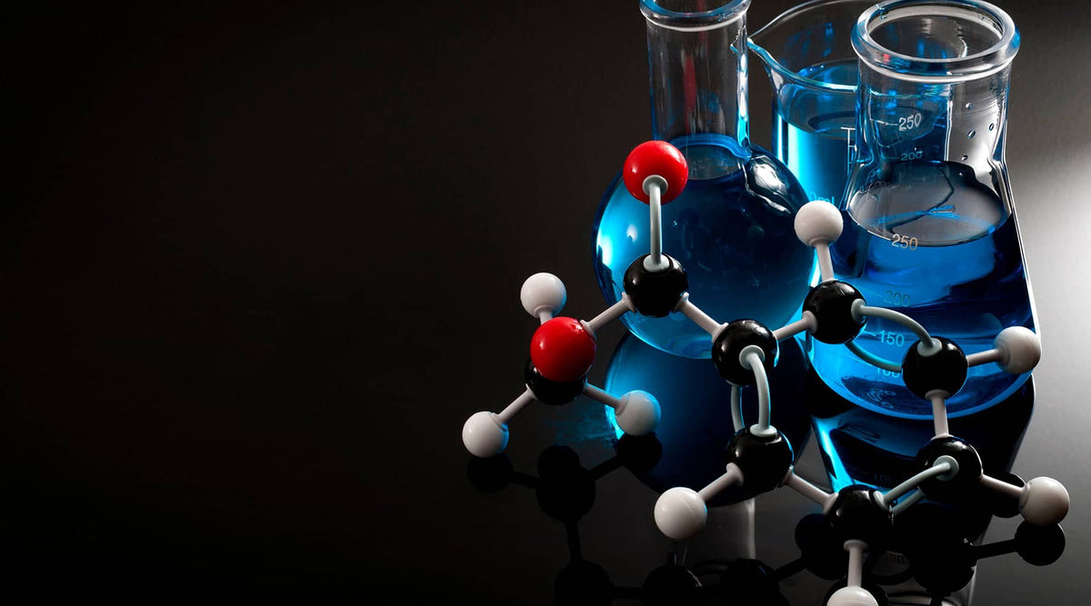 Banner of a ball-and-stick model and beakers with blue fluid on a black background