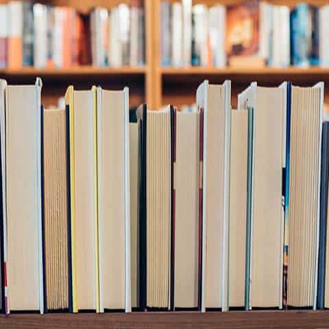 Homeschool curriculum books on a shelf