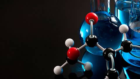 Homeschool chemistry curriculum banner of ball-and-stick models with beakers and flasks containing blue liquid