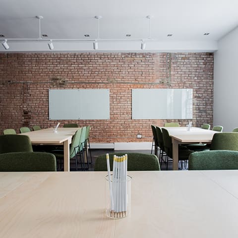 Science Shepherd homeschool co-op banner of desks with chairs, a cup of pencils and whiteboard on the wall