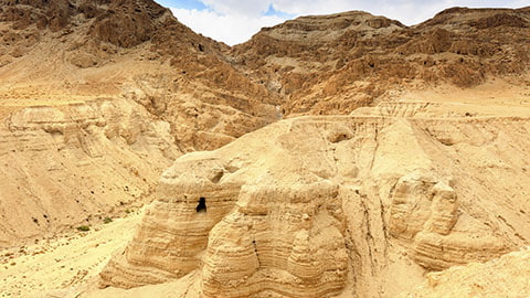 Unearthing the Bible homeschool curriculum banner showing a cave at Qumran