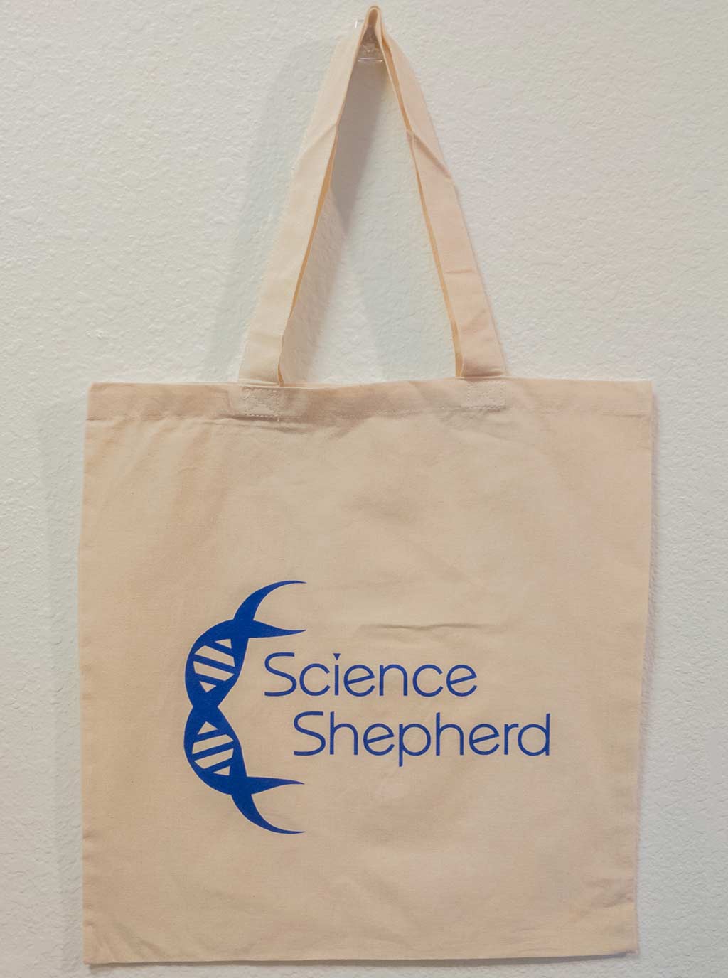 Creme colored homeschool curriculum tote with blue Science Shepherd logo